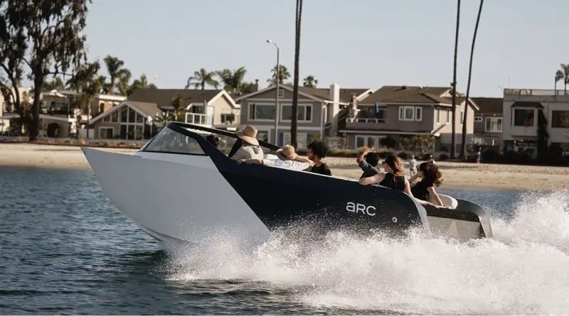 Arc One electric boat with 6 passengers speeding along through water