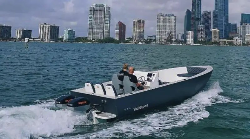 Canadian Electric Boat Company open speedboat in Miami harbour with skyline in background