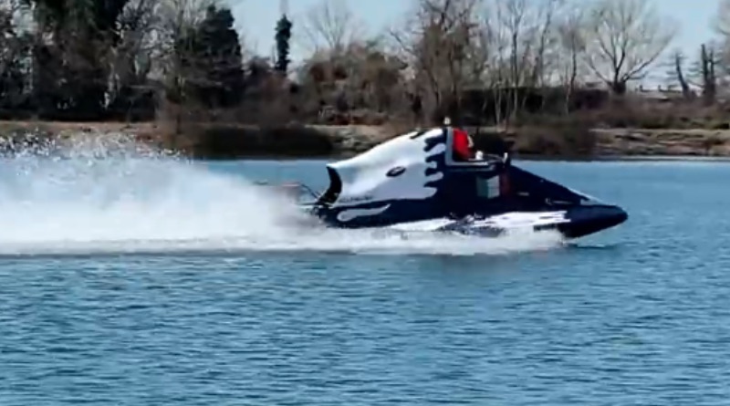 Boat with electric hydrojet doing a test run on a small lake