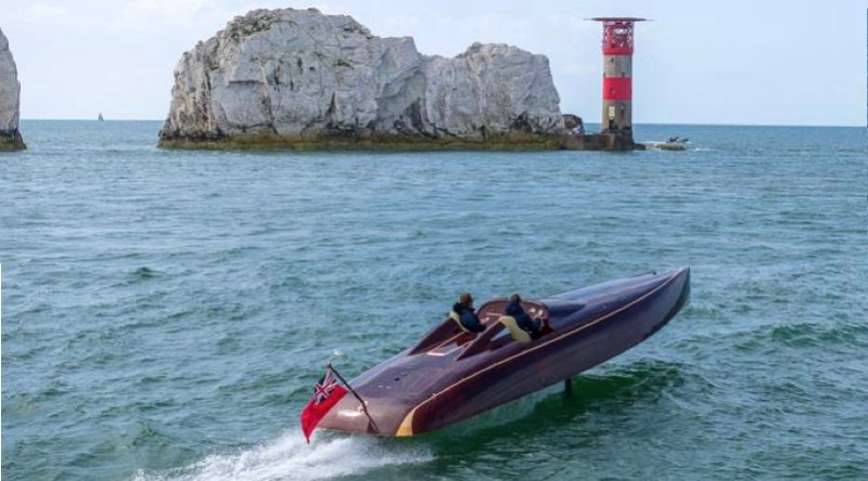 electric hydrofoiling boat going around The Needles of Isles of Wight