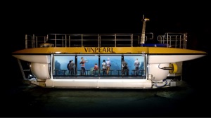 artist impression of electric powered submarine underwqater with passengers aboard looking through tube windows