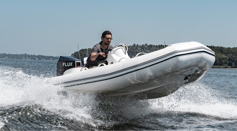 Flux electric outboard on a RIB as it speeds through the water