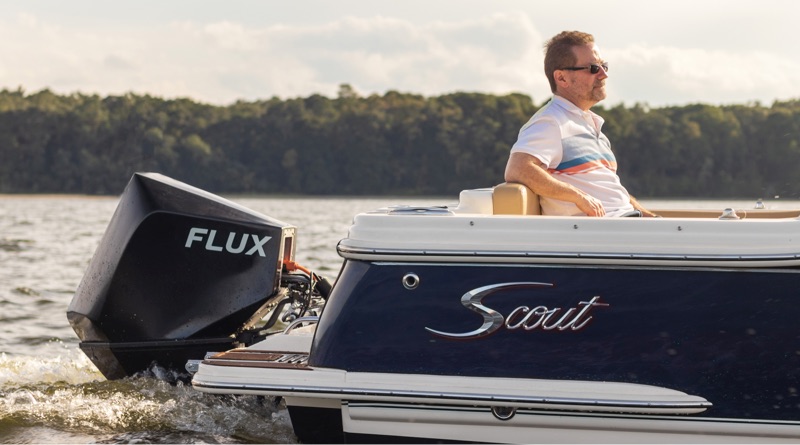 new electric outboard form Flux Marine on the stern of a Scout boat travelling along the water