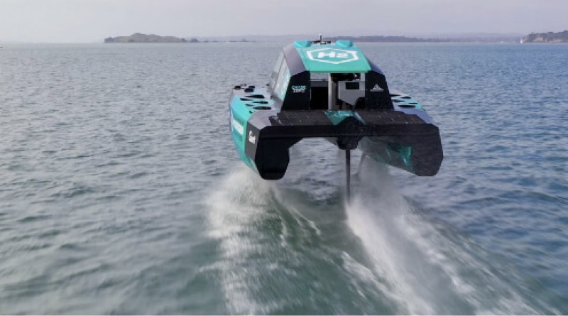 hydrofoiling hydrogen chase boat seen riding above the waves from behind