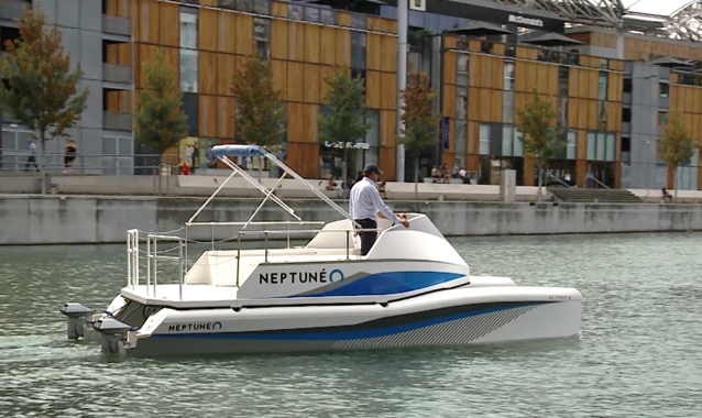 Neptuneo electric catamaran driving along a canal