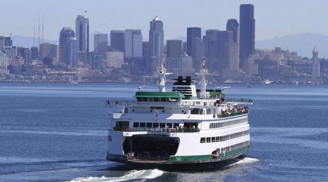 A 2500 passenger ferry in Puget Sound with Seattle in the bakground