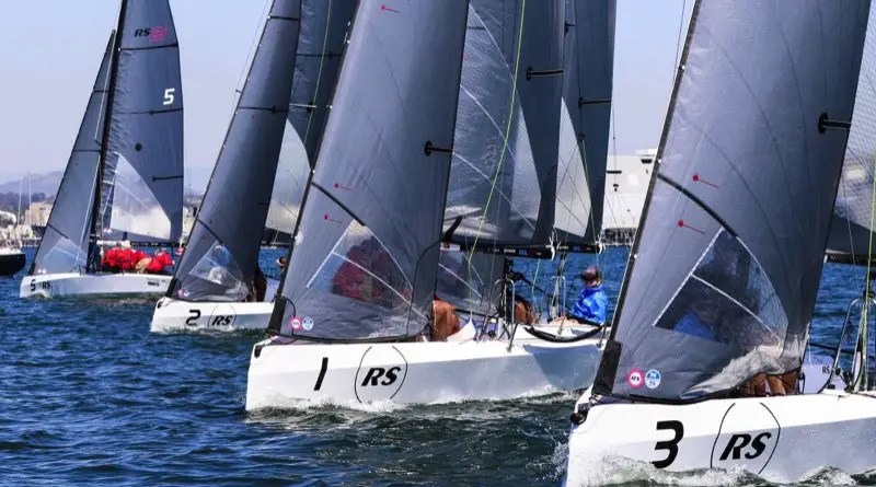 three 21ft sailboats on a sunny day