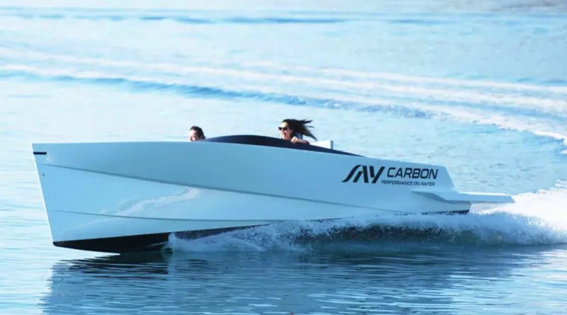 World's fastest electric boat speeds over the water leaving a wake