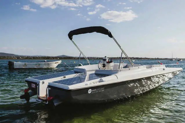 Runabout type boat with solar panels on its decks