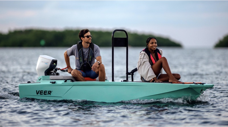 Couple on Veer boat with Mercury electric outboard