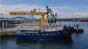 all electric tugboat at land-based charging station