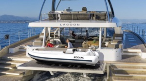 Zodiac electric boat 450 eJET on the back of a double story catamaran yacht